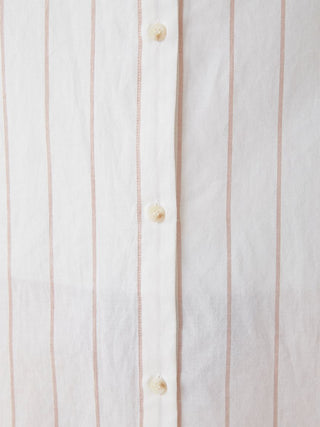 Close-up of Resort Woven Striped Shirt Midi Dress fabric with vertical neutral-tone stripes and buttons.