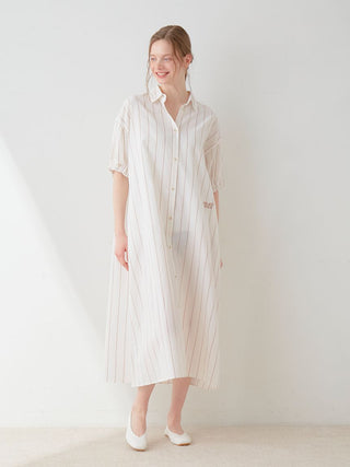 Woman wearing Resort Woven Striped Shirt Midi Dress with vertical stripes and neutral tones, exuding timeless elegance and refined style.