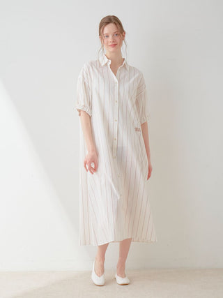 Woman wearing Resort Woven Striped Shirt Midi Dress in neutral tones, showcasing elegant vertical stripes and contemporary style.
