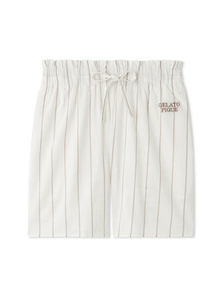 White striped lounge shorts with elastic waistband and drawstring, featuring "Gelato Pique" embroidery on the side.
