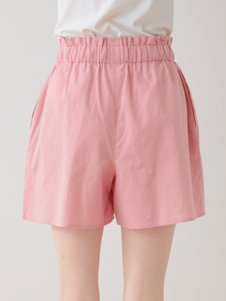 Soft pink woven lounge shorts offering ultimate comfort and casual style with a feminine touch, perfect for relaxing in elegance.