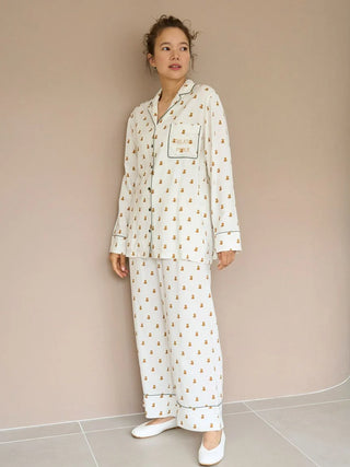 Woman wearing elegant Variation Pajama Pants set, featuring soft lightweight fabric with a delicate print, ideal for comfortable lounging.