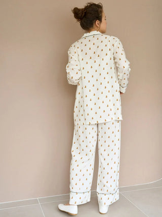 Elegant Variation Pajama Pants with delicate pattern, offering comfort and style for lounging. Model wearing full set, back view.