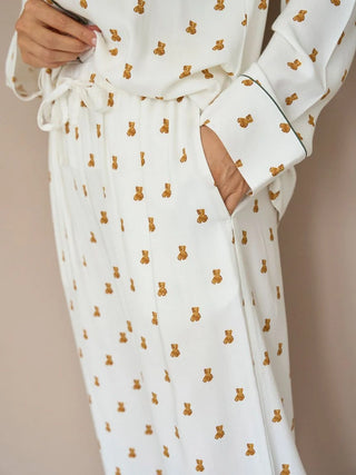 Woman wearing Variation Pajama Pants with teddy bear print from Gelato Pique, showcasing soft lightweight fabric and comfortable fit.