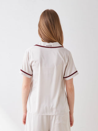 Back view of elegant lined satin sleep shirt with open collar showcasing chic design and luxurious comfort.