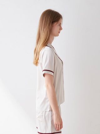 Side view of lined satin sleep shirt with collar in elegant design, luxurious comfort, chic color scheme, perfect for sophisticated slumber.