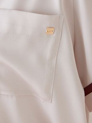 Close-up of Lined Satin Sleep Shirt pocket detail in chic color scheme design, highlighting the luxurious satin fabric and stitching.