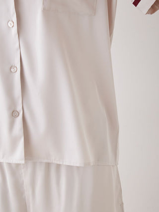 Close-up of Lined Satin Sleep Shirt with buttons and elegant design, showcasing luxurious comfort and chic style in soft off-white color.