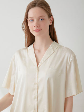 Model wearing Flower Satin Pajama Sleep Shirt by Gelato Pique in ivory with floral print, exuding luxury and elegance.