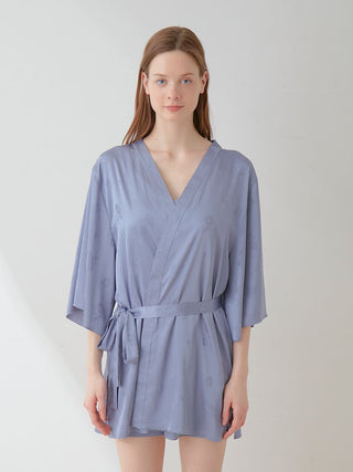 Model wearing Flower Long Sleeve Satin Tie Nightgown Robe in soft floral print, showcasing luxurious loungewear style.