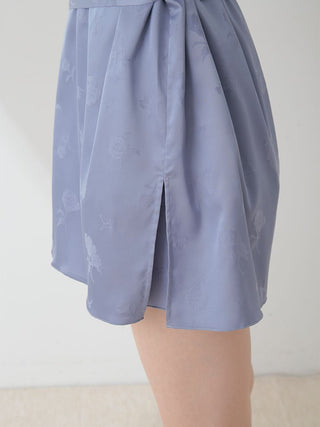 Close-up of blue satin nightgown robe with floral pattern and tie, featuring elegant side slit design.