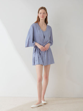 Model wearing a blue satin tie nightgown robe with floral pattern, long sleeves, elegant loungewear, Gelato Pique fashion.