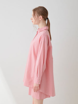 Side view of a pink Resort Woven Long Sleeve Oversized Shirt, highlighting its relaxed fit and high-quality woven fabric.