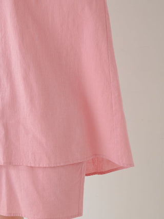 Close-up of pink woven fabric on Resort Woven Long Sleeve Oversized Shirt showcasing texture and relaxed fit