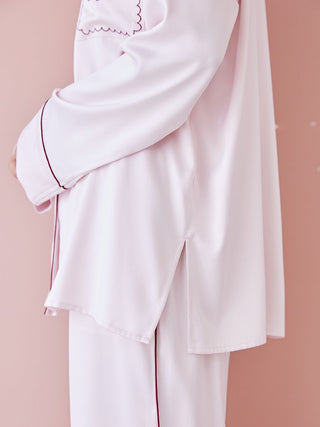 Side view of piping satin long sleeve pajama shirt showcasing elegant piping detail and silky fabric.