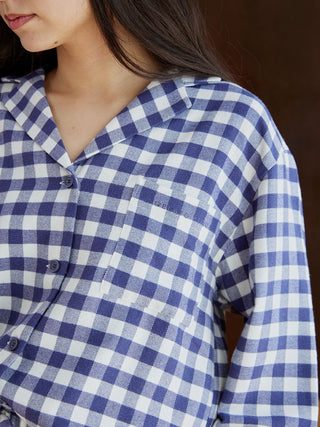 Close-up of Gelato Pique's checkered long sleeve sleep shirt in blue and white, showcasing button details and soft fabric.