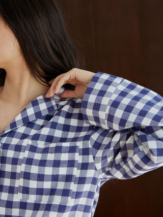 Close-up of checkered long sleeve sleep shirt in soft fabric, highlighting its classic pattern and comfortable texture for restful sleep.