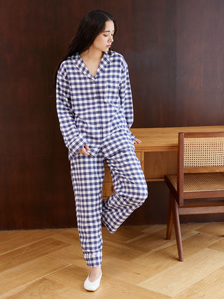 Woman wearing Gelato Pique checkered long sleeve sleep shirt and pants.