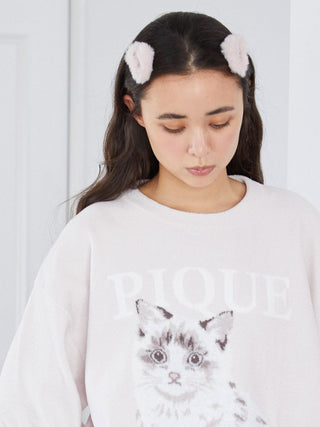 Woman wearing soft, eco-friendly faux fur hair clips, styled for a chic look with a cozy touch, without damaging the hair.