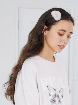 Woman wearing a Gelato Pique Eco Fur Hair Clip, showcasing its soft, eco-friendly faux fur and chic, cozy touch on long brown hair.