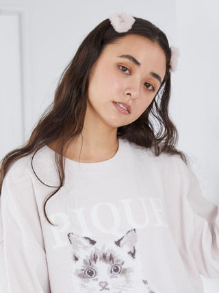 Woman wearing Eco Fur Hair Clip with soft faux fur, styled in a comfortable and chic look, paired with a cozy sweater featuring a cat design.