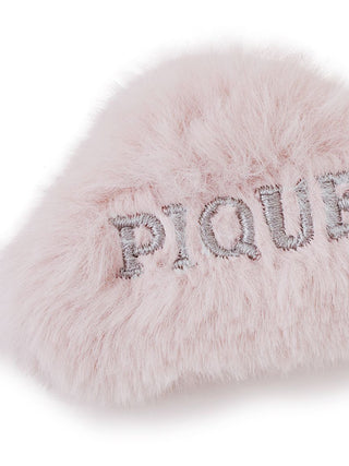 Close-up of Gelato Pique eco-friendly faux fur hair clip with plush texture and embroidered 'Pique' lettering in light pink color.