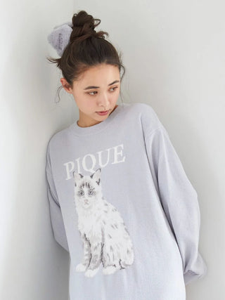 Model wearing oversized sweater with cat print and Eco Fur Claw Clip, styled in a messy bun, showcasing cozy fashion and unique accessories.