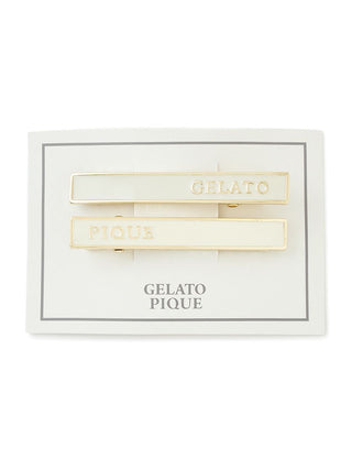 Set of two Gelato Pique metal hair clips with gold-tone edges and "GELATO" and "PIQUE" branding on white card.