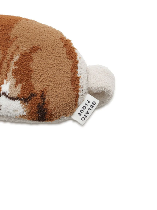 Close-up of Gelato Pique Sleeping Dog eye mask with plush texture, showcasing playful design.