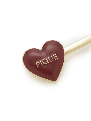 Glossy heart-shaped hairpin with "Pique" text and gold-tone accents from the Heart Hairpin Set, elegant accessory by Gelato Pique USA.