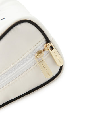 Close-up of satin pouch's embossed zippers, highlighting elegant design and sophisticated charm.