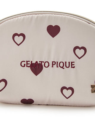 Heart Pattern Pouch with maroon hearts design and logo; half-moon shape fits a small bag. Effortlessly girly style. Compact and glossy.