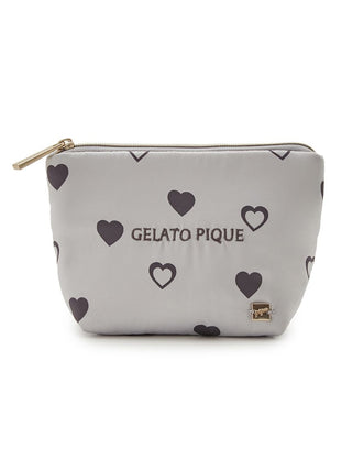 Heart pattern tissue pouch with glossy texture, features black hearts and zip closure, perfect for stylish convenience.