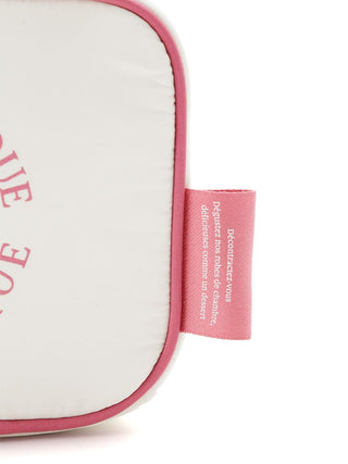 Off-white tissue pouch with pink trim, featuring a circular logo and elegant design details for chic travel convenience.