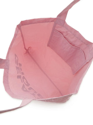 Interior view of a pastel pink Gelato Pique tote bag, featuring a large compartment and logo text on the side.