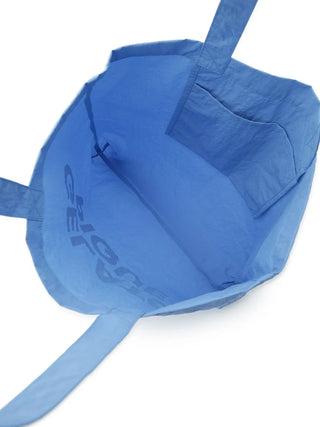 Inside view of a blue Gelato Pique pastel tote bag showing spacious interior and pocket.