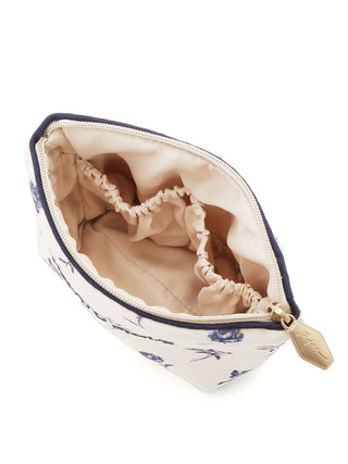 Open rose-patterned tissue pouch with elastic compartments, featuring a full-zip closure, by Gelato Pique USA.