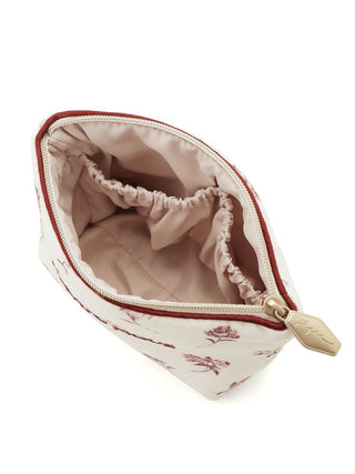 Open rose-patterned tissue pouch with pink and grey floral design, showing zip closure and inner compartments by Gelato Pique USA.