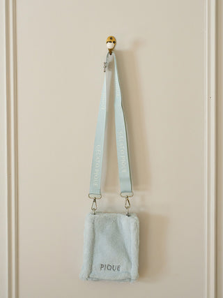 Faux Fur Mini Sling Bag by Gelato Pique, eco-friendly and stylish with soft plush texture, hanging against a beige background.