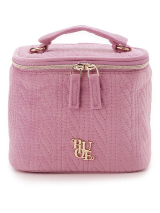 Pink Aran quilted cosmetic bag with cable pattern, featuring zip-around closure and top handle for convenient beauty storage.