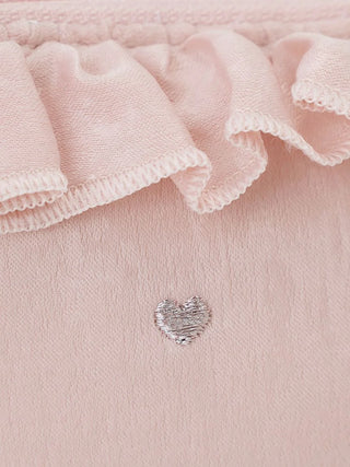 Close-up of pink fabric tissue pouch with silver heart embroidery and frilled edge detail.