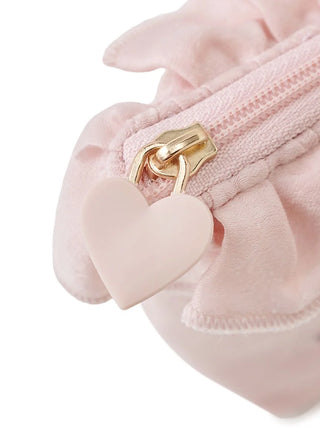 Close-up of pink tissue pouch with heart zipper pull and ruffled edges