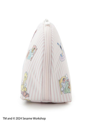 Side view of Sesame Street character cosmetic pouch in blush pink with vertical stripes and bedtime scene illustrations.