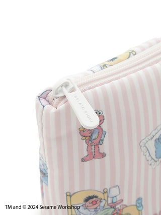 Alt Tag: Sesame Street character zipper pouch with illustrations on pastel striped fabric, featuring cozy bedtime scenes.