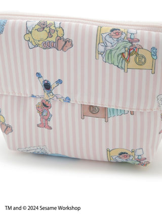 SESAME STREET character zipper pouch with bedtime scene illustrations and pastel stripes.