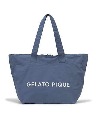 Navy tote bag with 'Gelato Pique' logo, ideal for versatile use including travel and daily commutes.