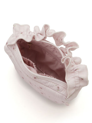Alt Tag: Premium loungewear tissue pouch with cherry blossom design, frills, and logo by Gelato Pique USA, open to show inside.