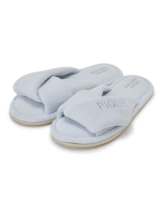 Light blue pile cozy indoor slippers with a wide, overlapping strap ensuring a snug fit, designed for ultimate comfort.