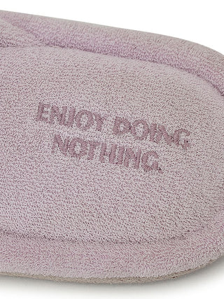 Luxurious pile cozy slipper in lavender with embroidered text 'Enjoy Doing Nothing' on the sole, perfect for relaxing comfort.