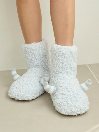 Fluffy blue indoor slipper boots resembling monster feet, designed as Pique Monster Room Boots for Halloween.
